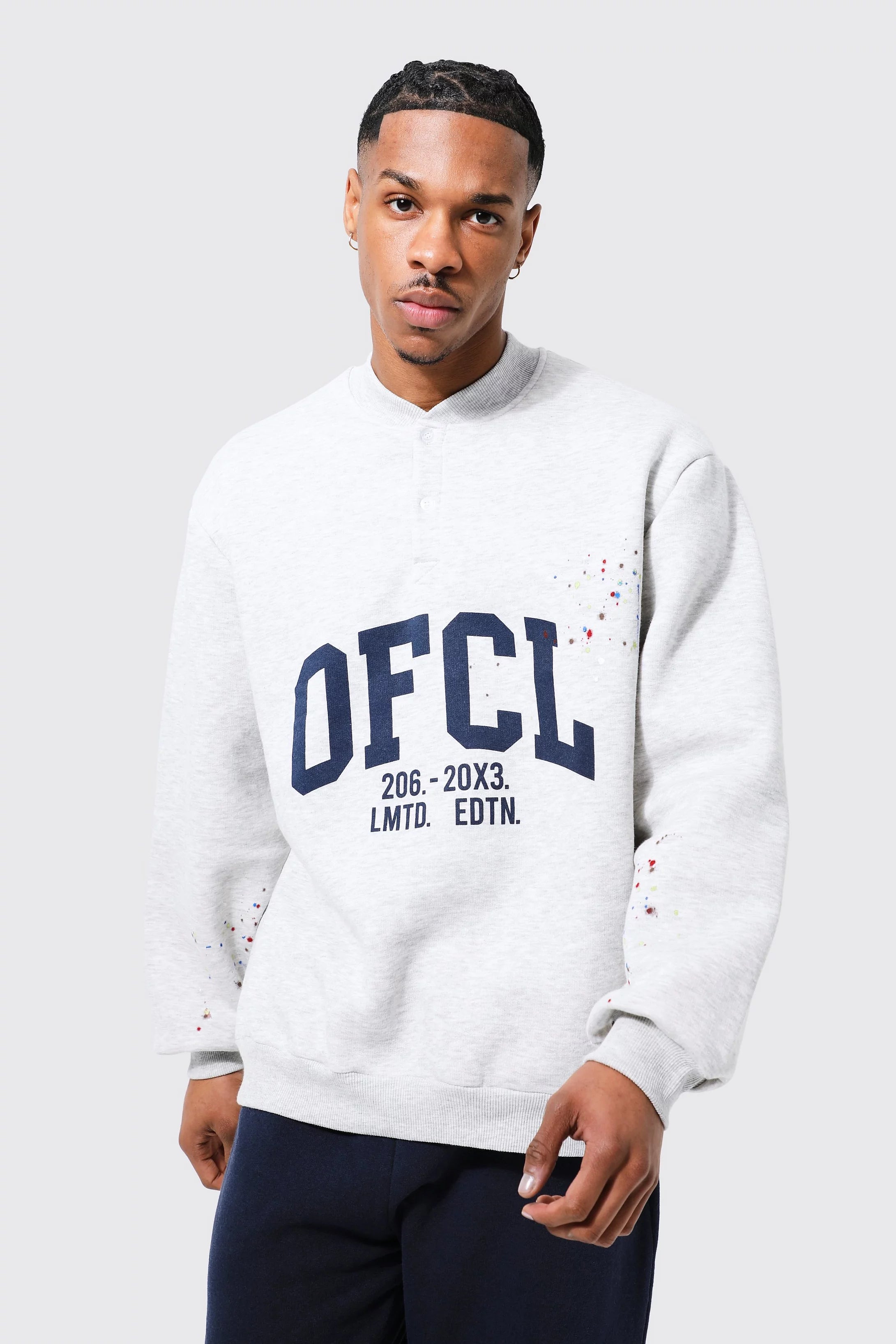 BOOHOOMAN OVERSIZED VARSITY PAINT SPLATTER SWEATSHIRT Garmisland