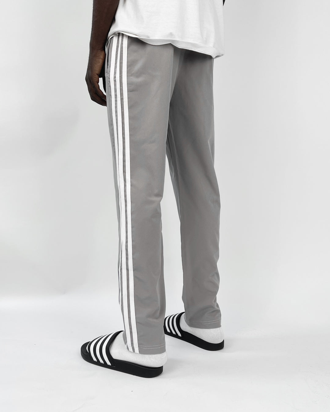 Adidas reflective logo track pants in dark grey