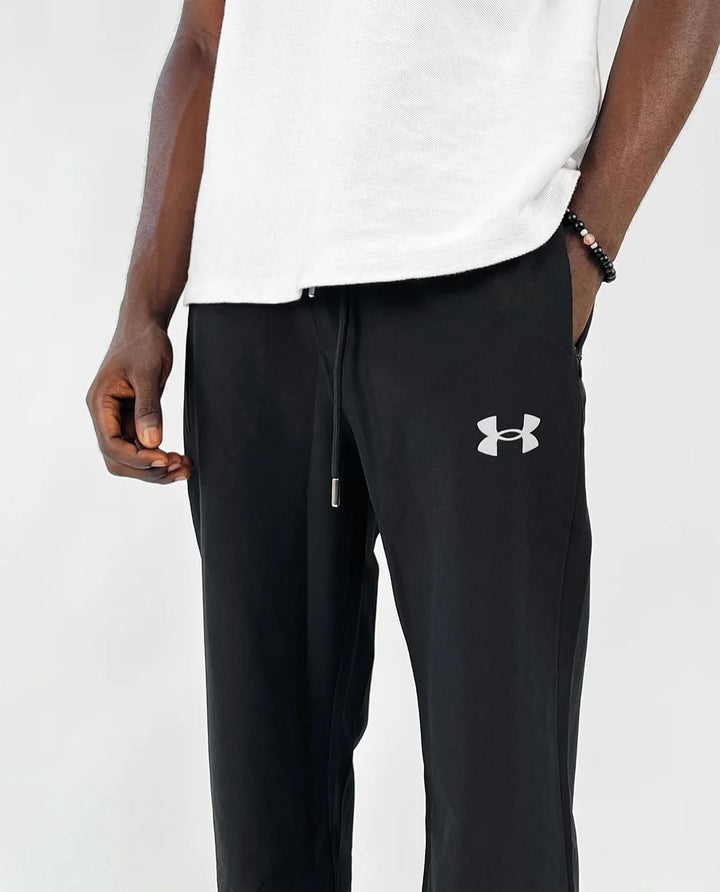 Under armour logo track pants in black