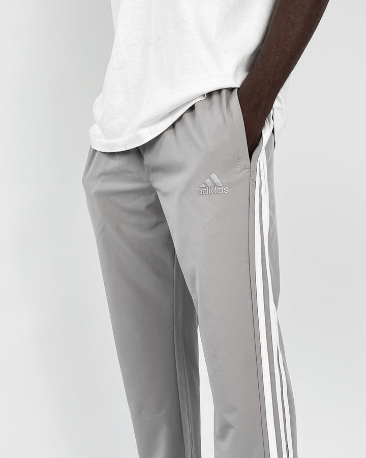 Adidas reflective logo track pants in dark grey