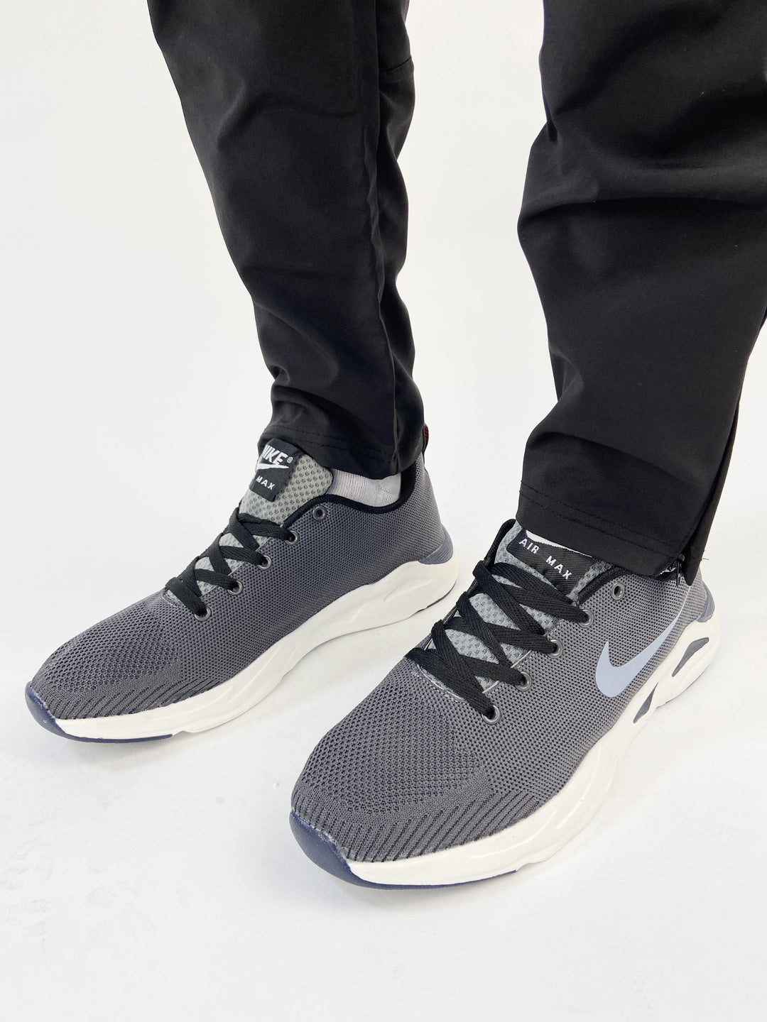 Nike air max trainers with blue logo and orange  back tab