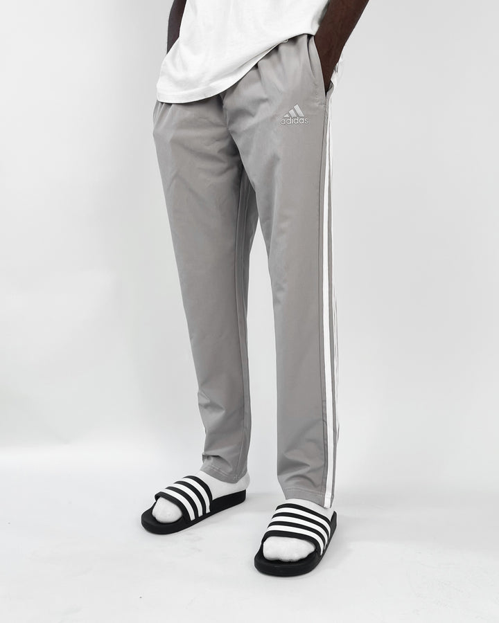 Adidas reflective logo track pants in dark grey