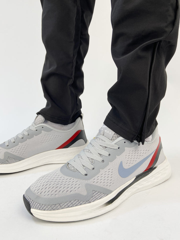 Nike air trainers in grey with red and black back details