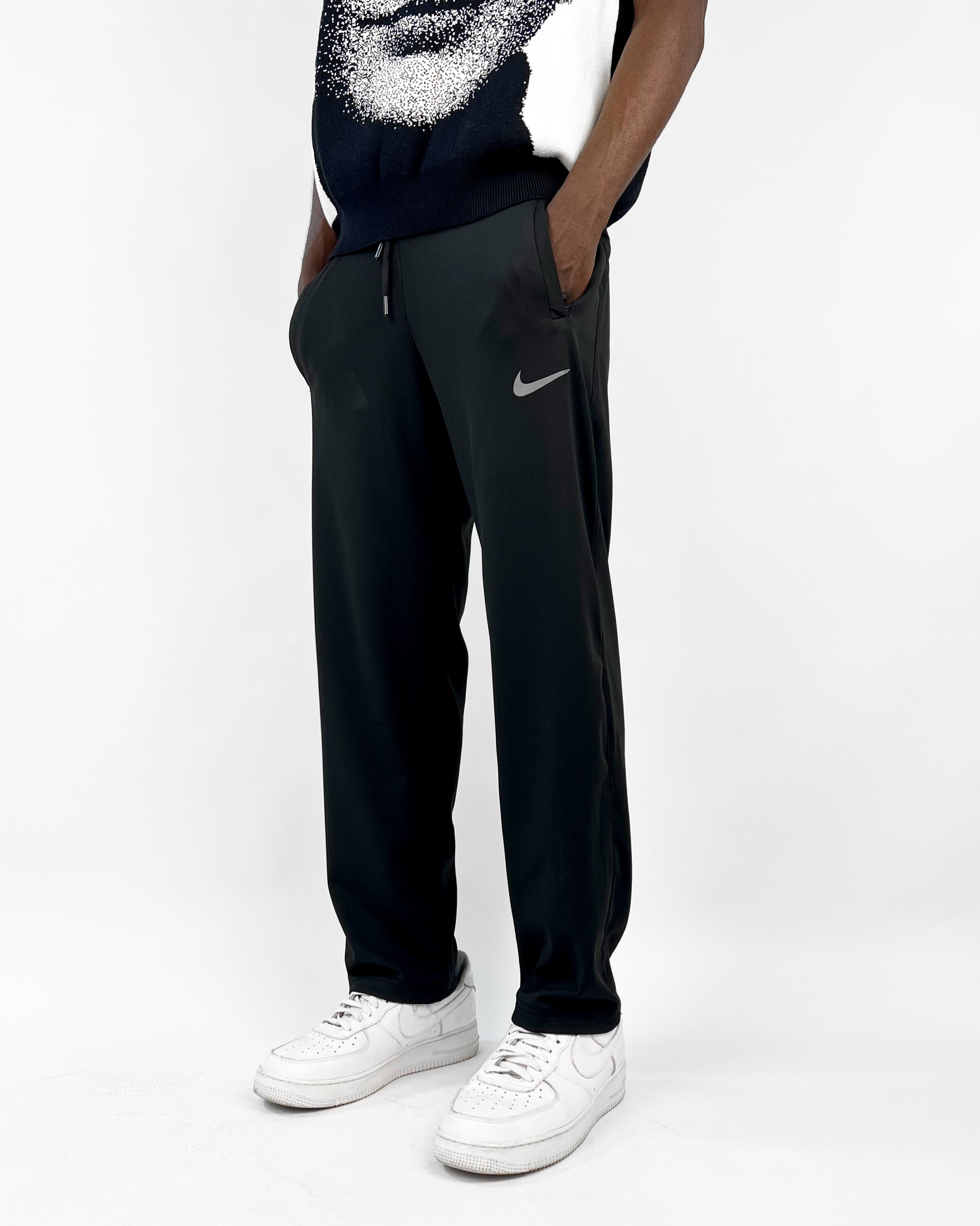 swoosh track pants