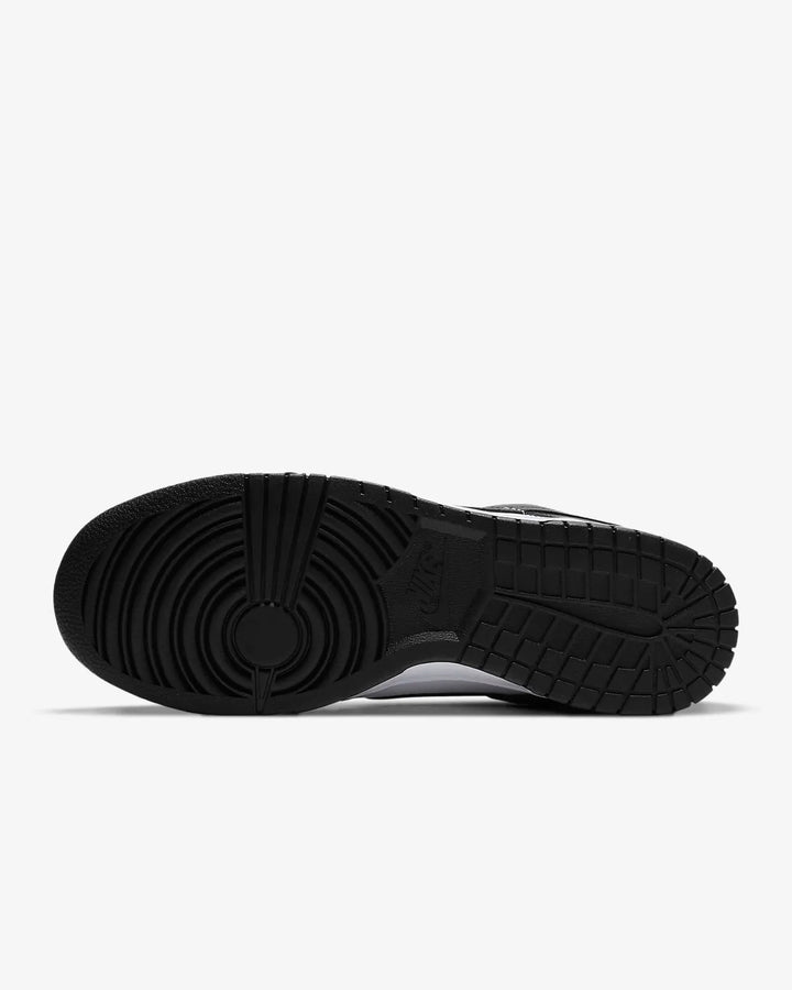 Nike Dunk Low Retro Trainers in black and white