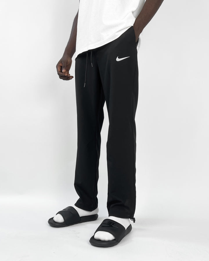 Nike reflective logo track pants in black