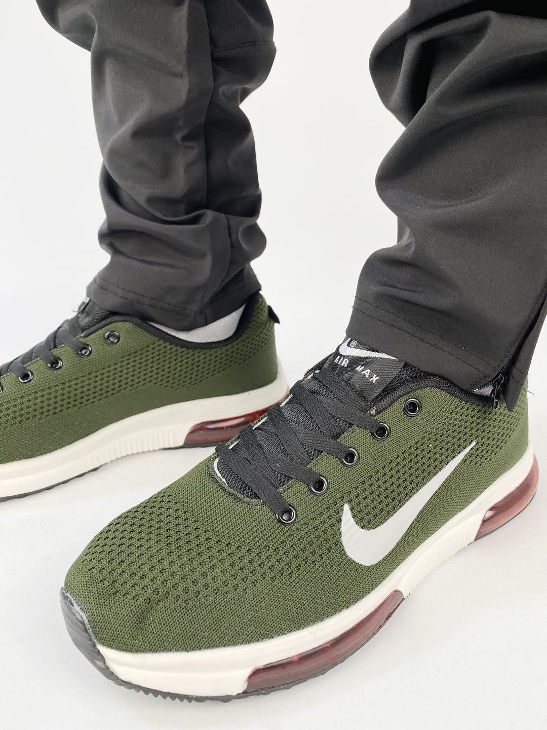 Nike air zoom textured green trainers with black and red sole