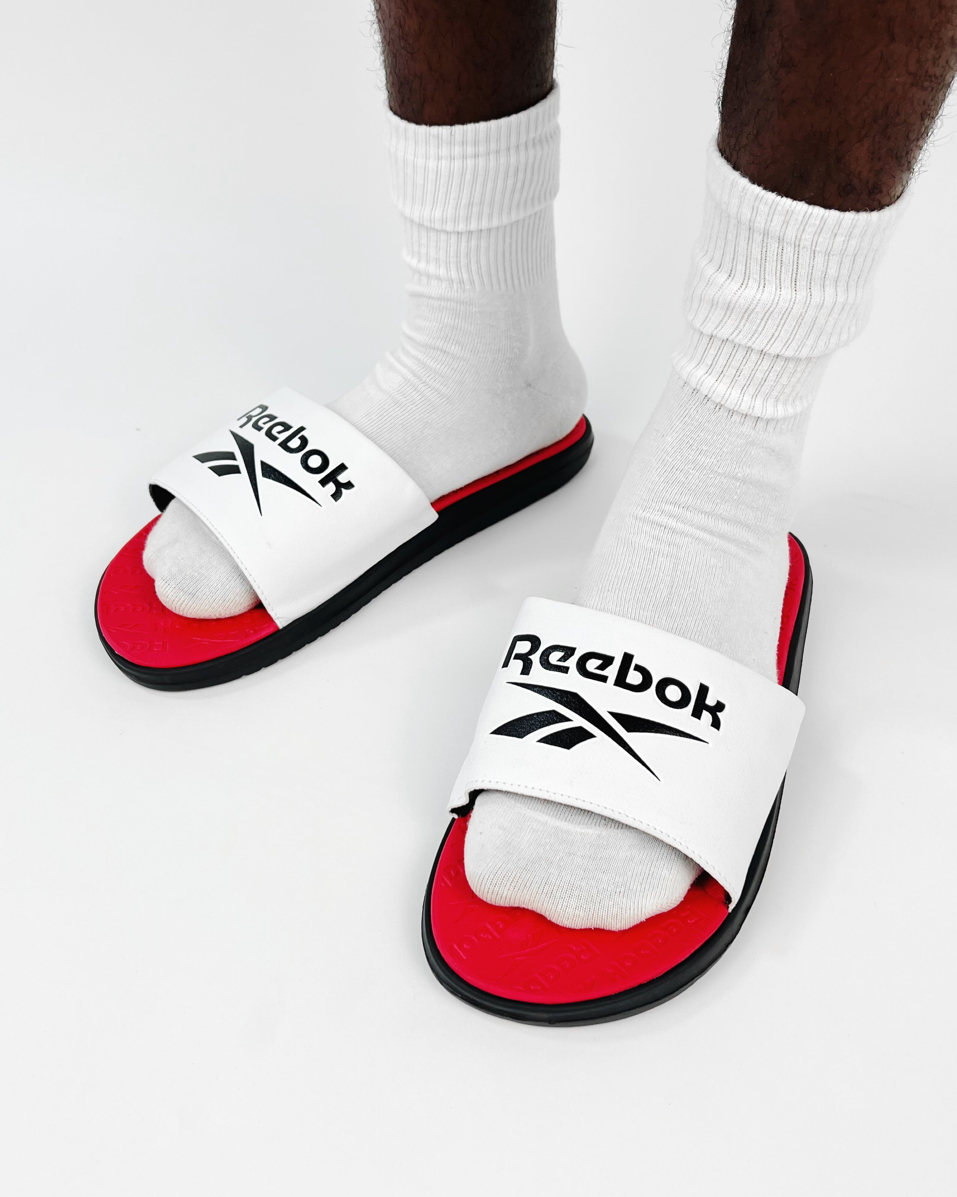 white reebok slides
