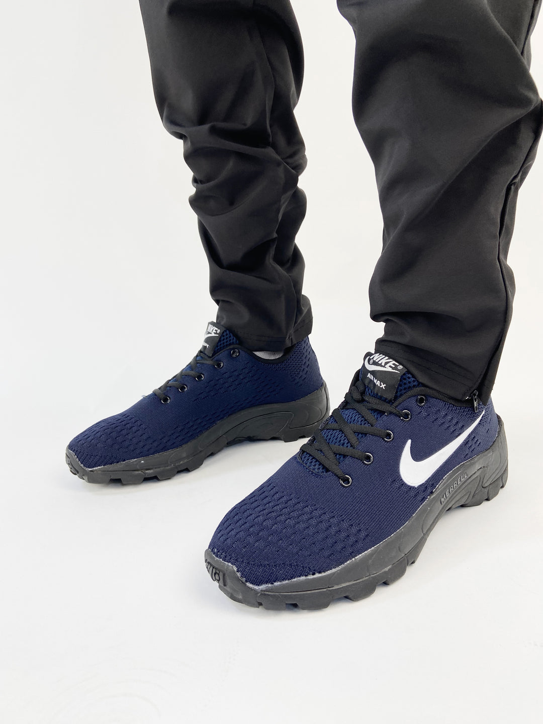 Nike air trainers in navy blue with black merrel print