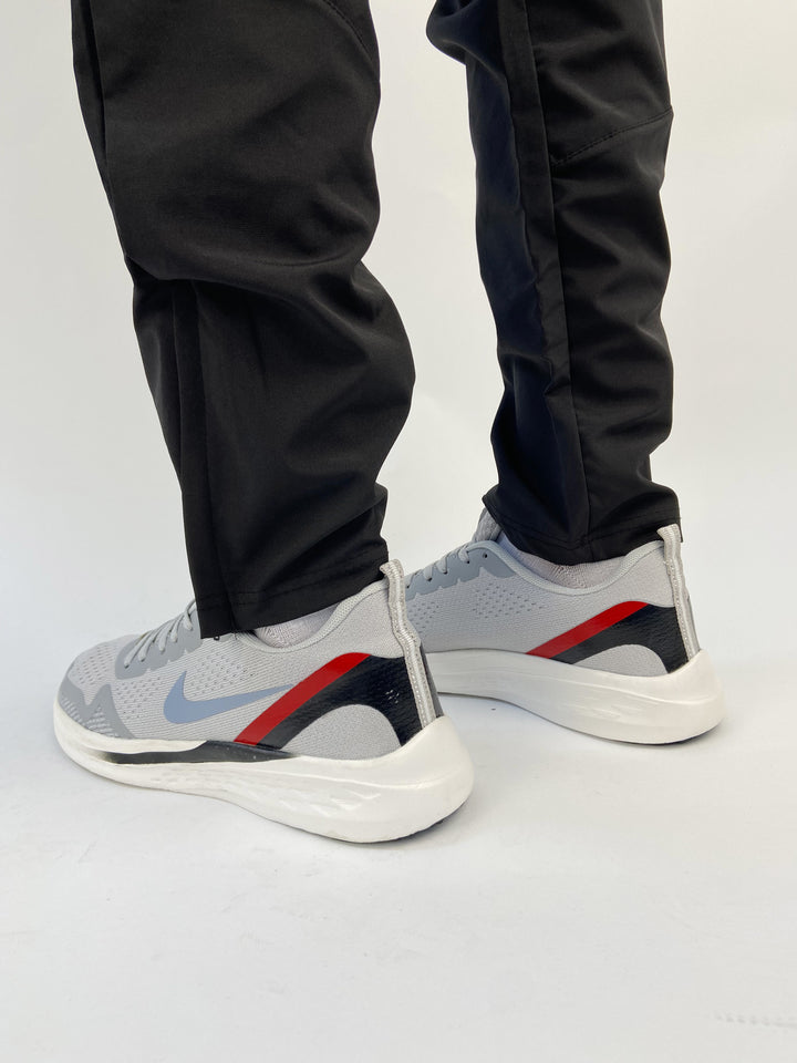 Nike air trainers in grey with red and black back details