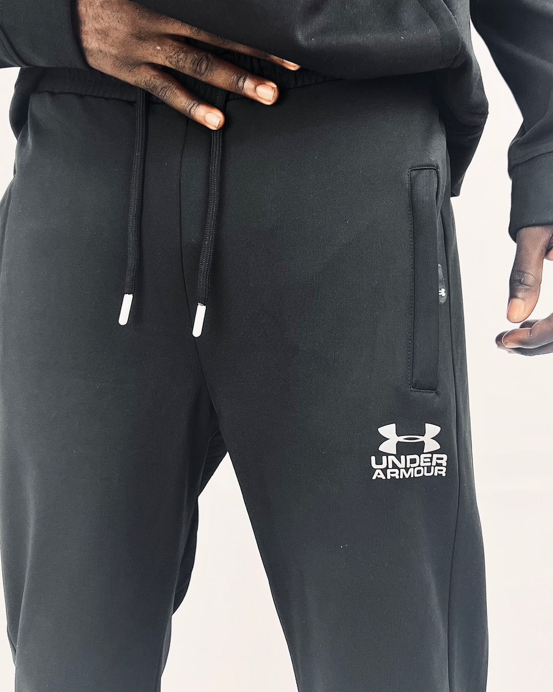 Under armour logo track pants in black