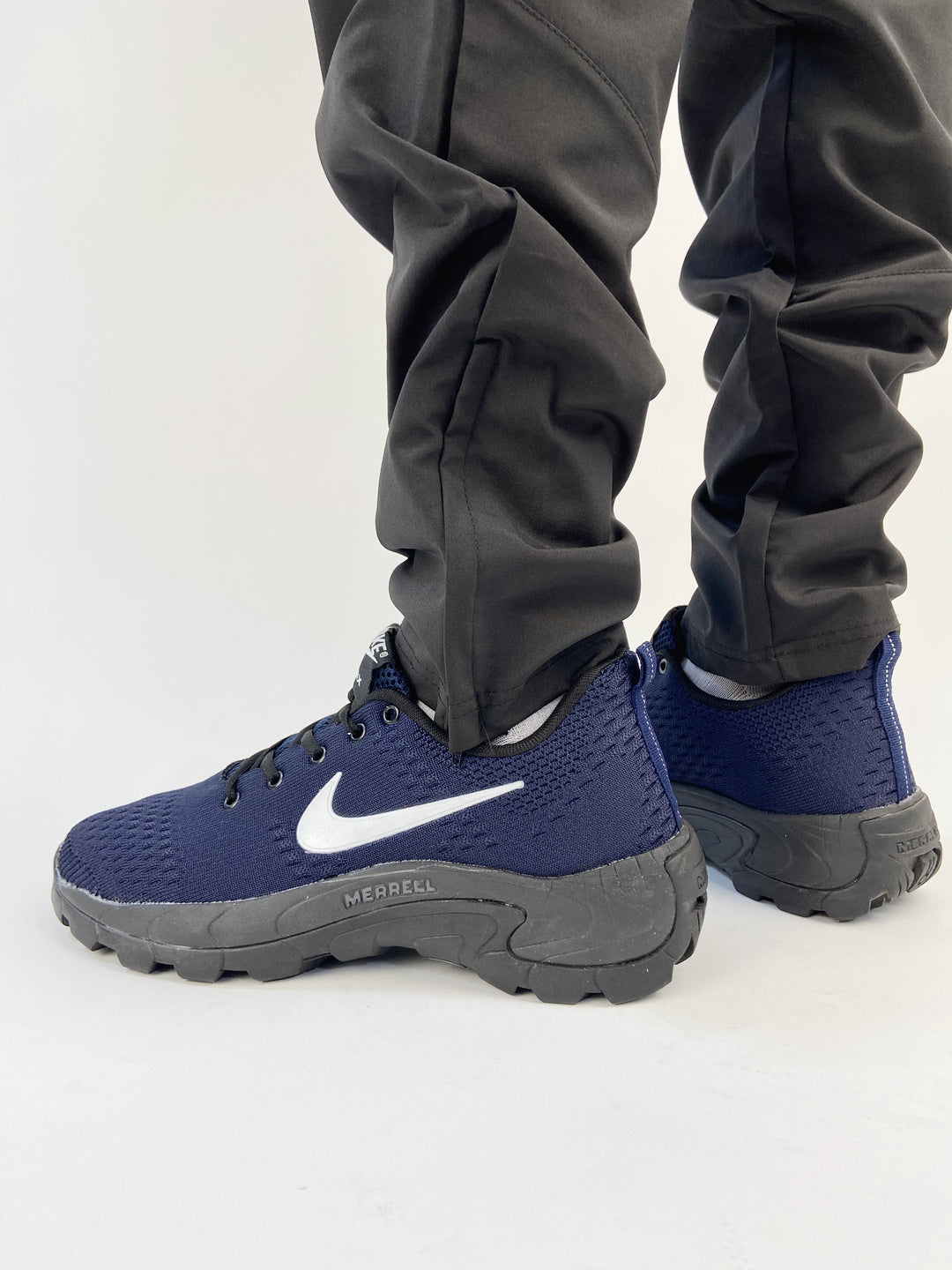 Nike air trainers in navy blue with black merrel print