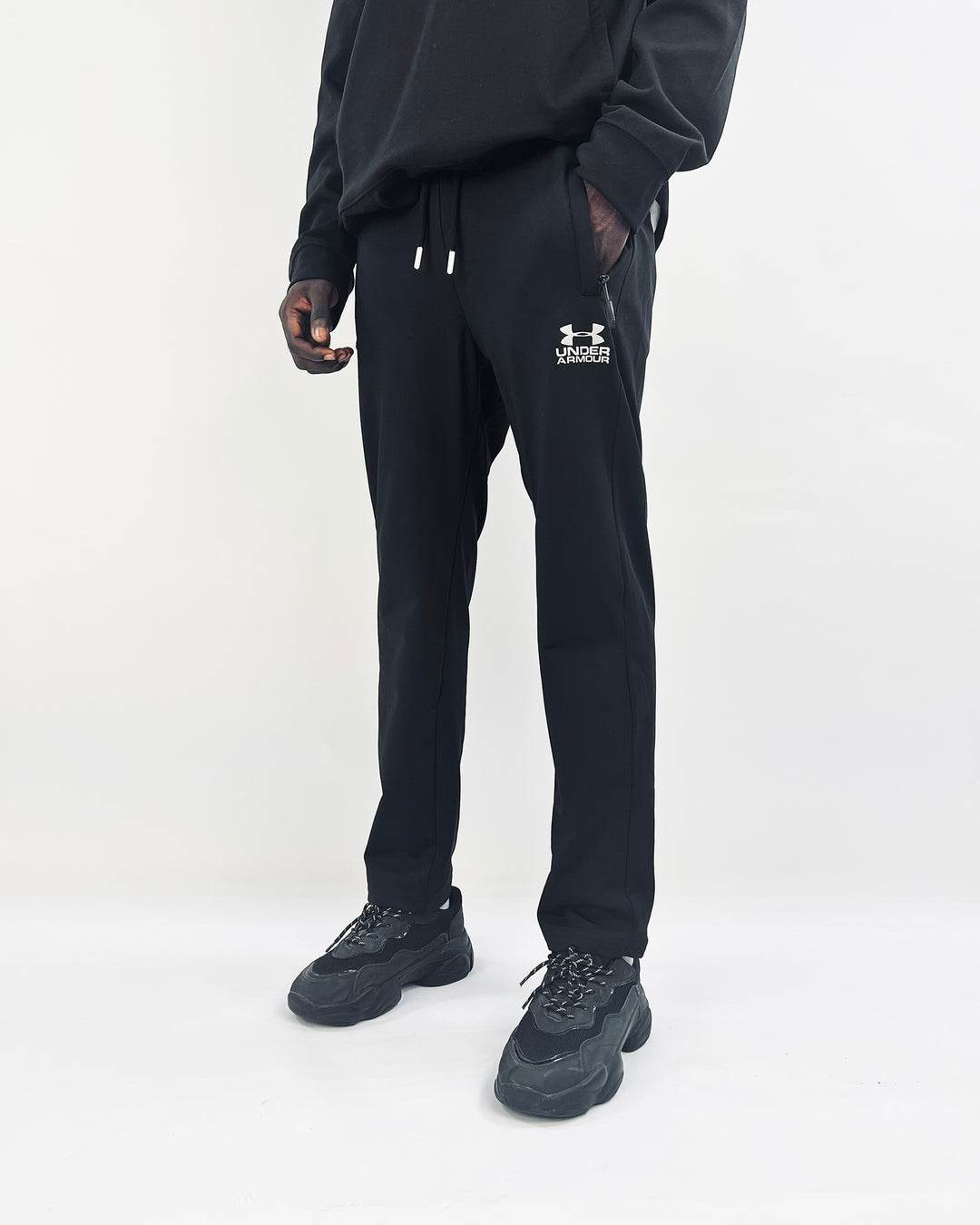 Under armour logo track pants in black