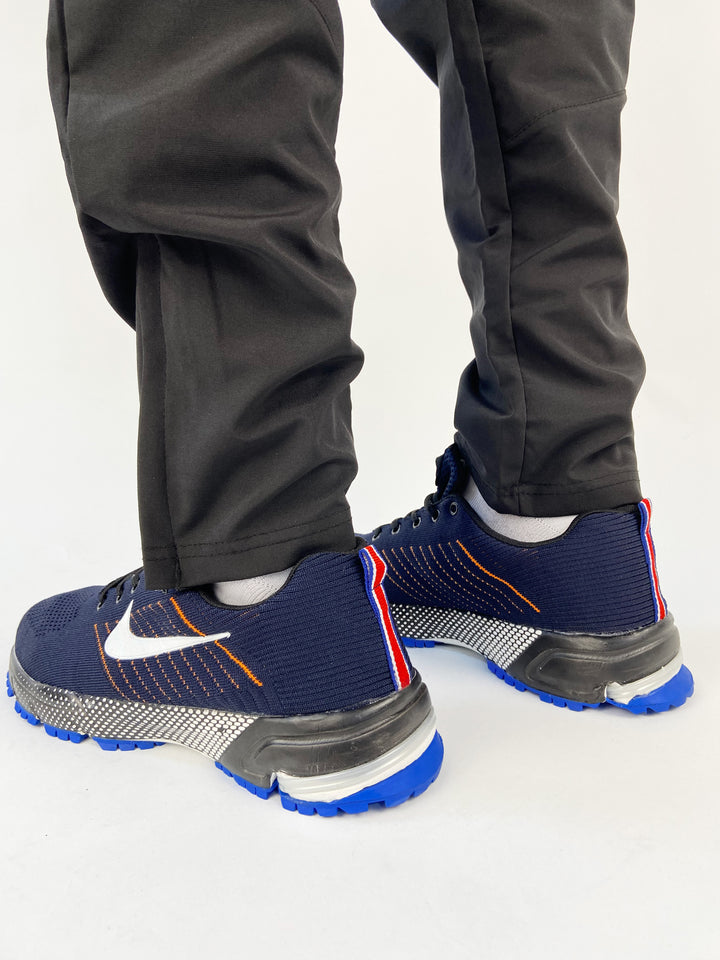 Nike air trainers in blue with orange highlights and black sole