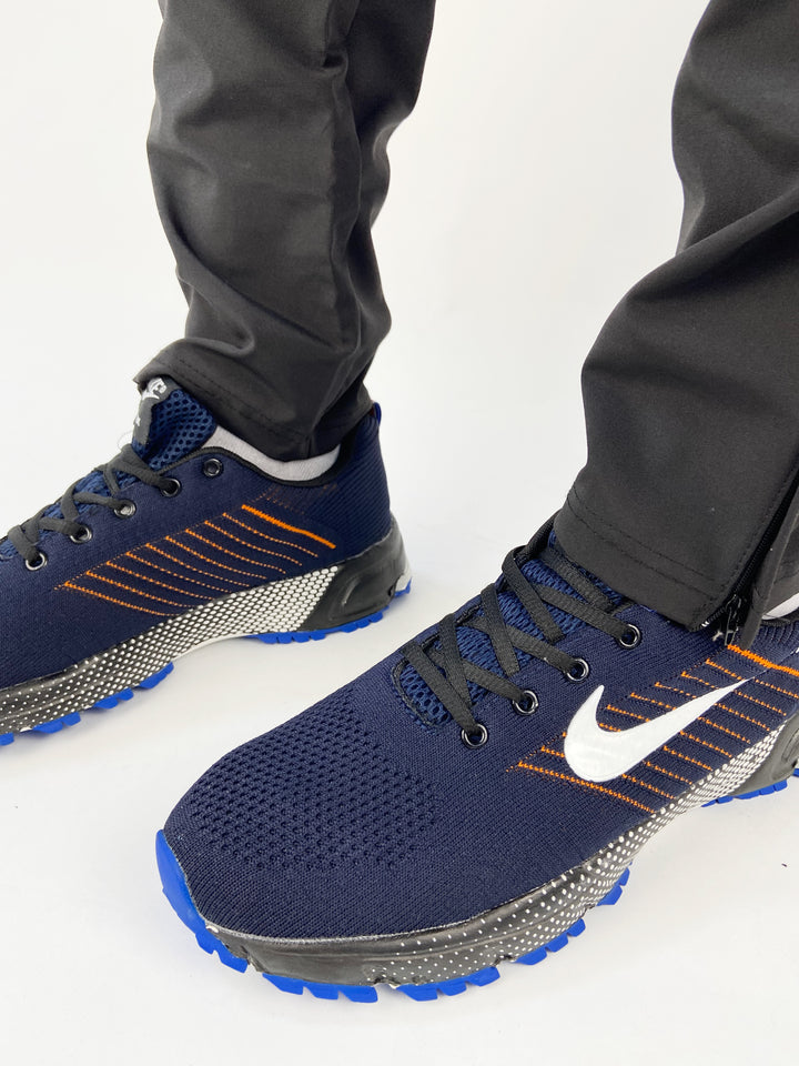 Nike air trainers in blue with orange highlights and black sole