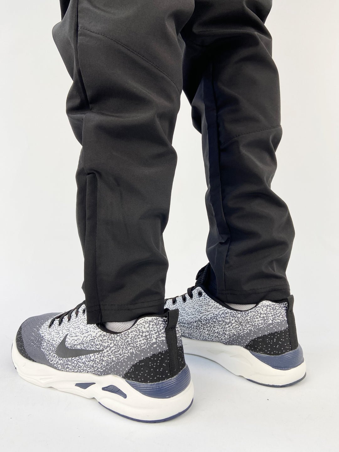 Nike air max trainers in black and white spots with blue soles