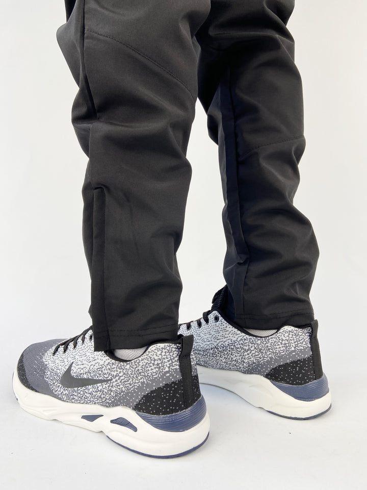 Nike air max trainers in black and white spots with blue soles