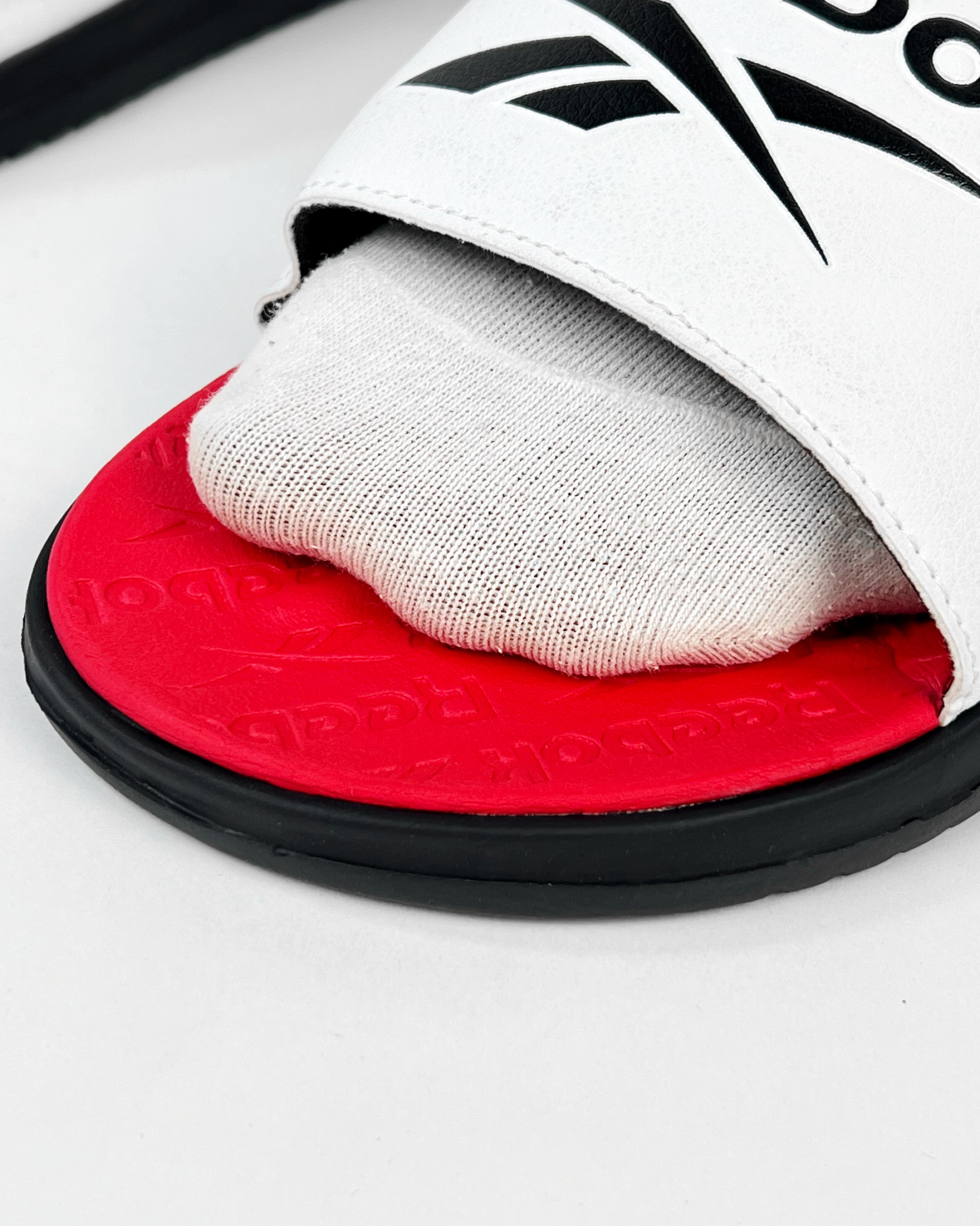 red reebok slides