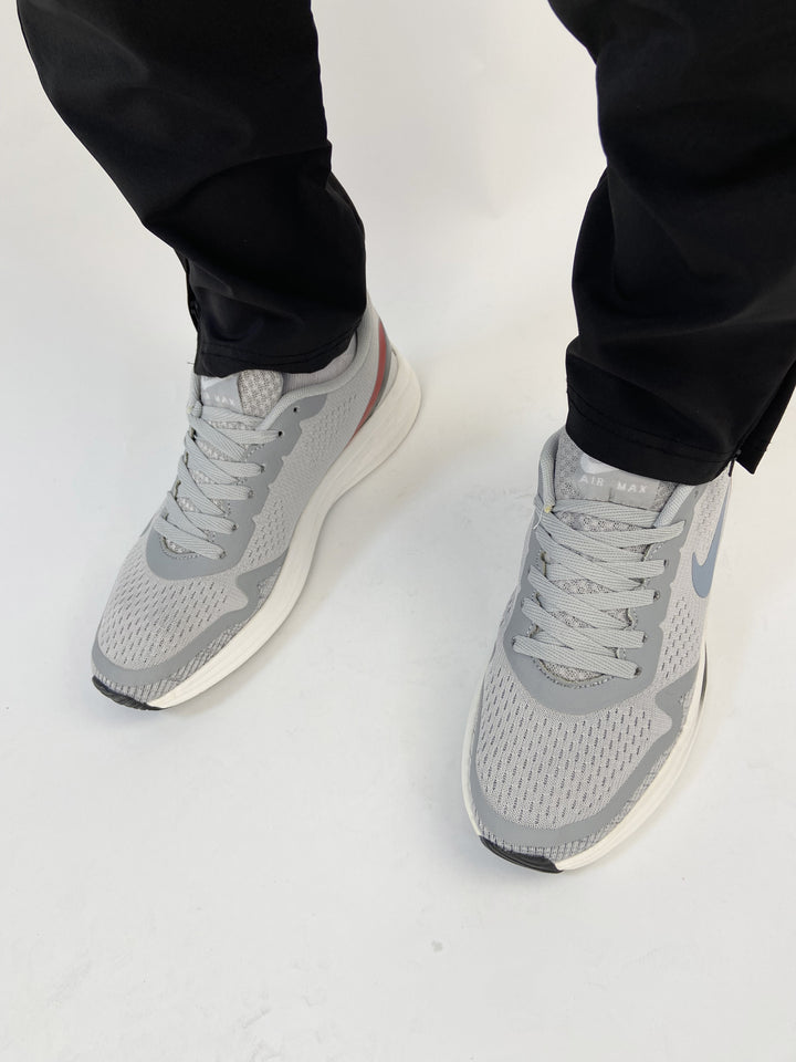 Nike air trainers in grey with red and black back details