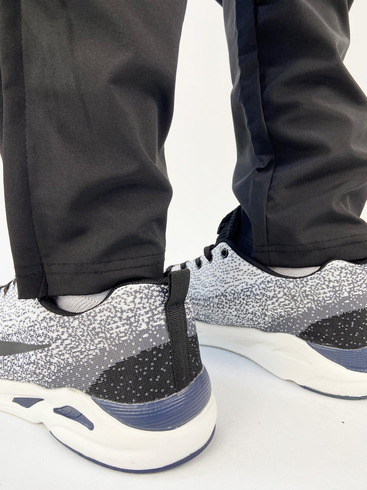 Nike air max trainers in black and white spots with blue soles
