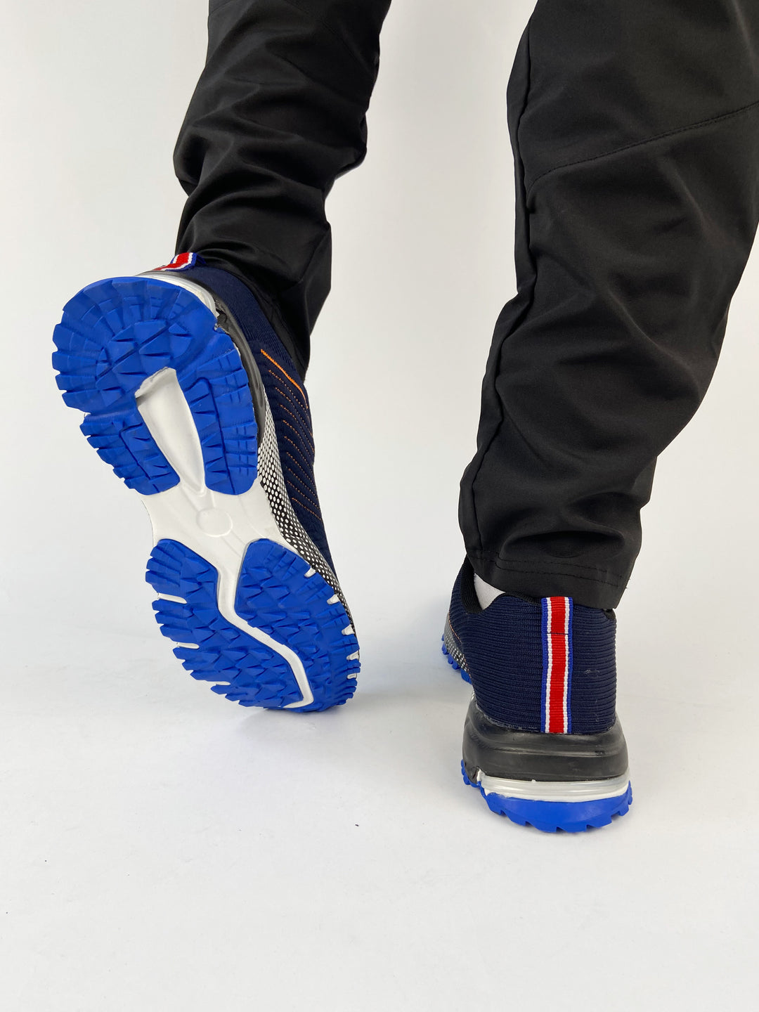 Nike air trainers in blue with orange highlights and black sole