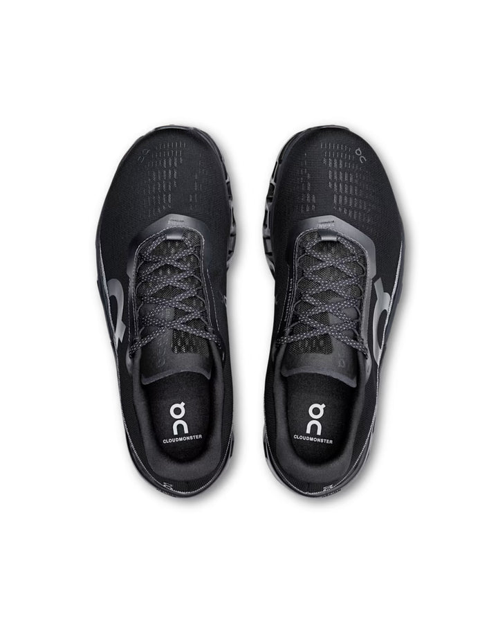 ON Cloudmonster running trainers in black