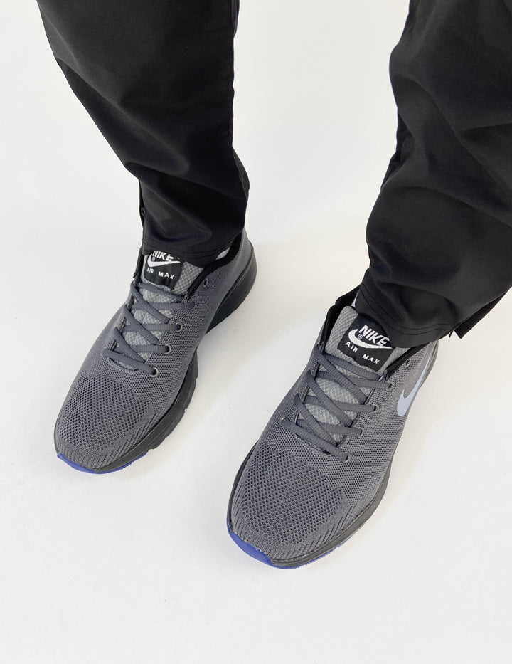 Nike air max trainers in grey with dark blue soles