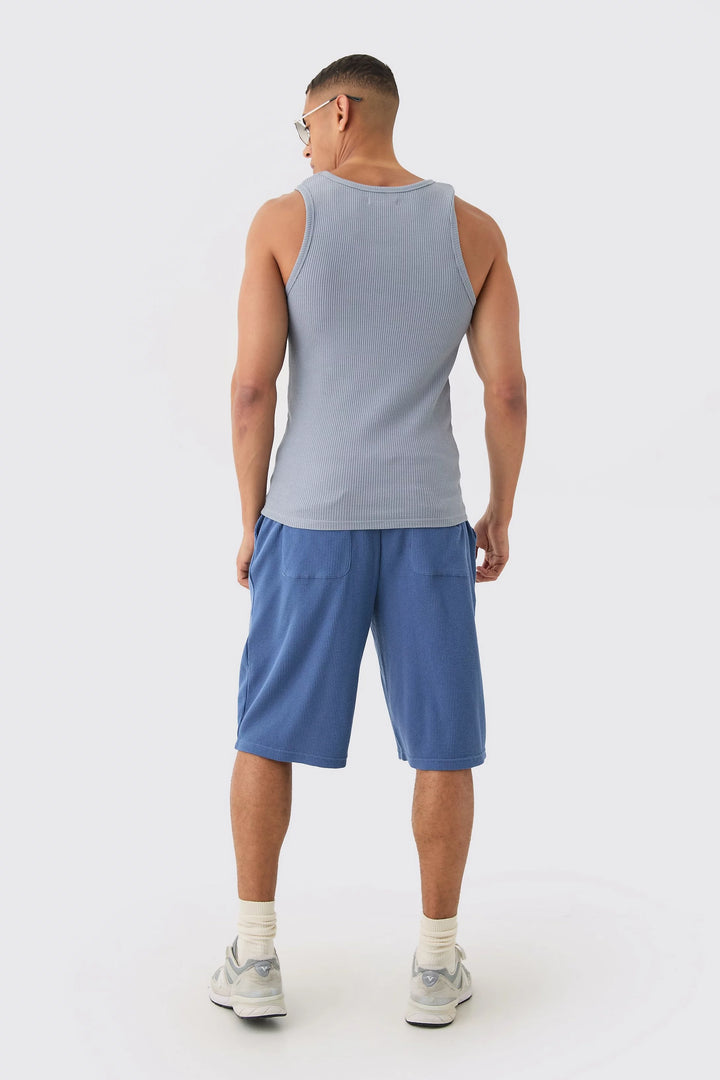 MAN SLIM WAFFLE RUBBER BADGE VEST SLATE BLUE