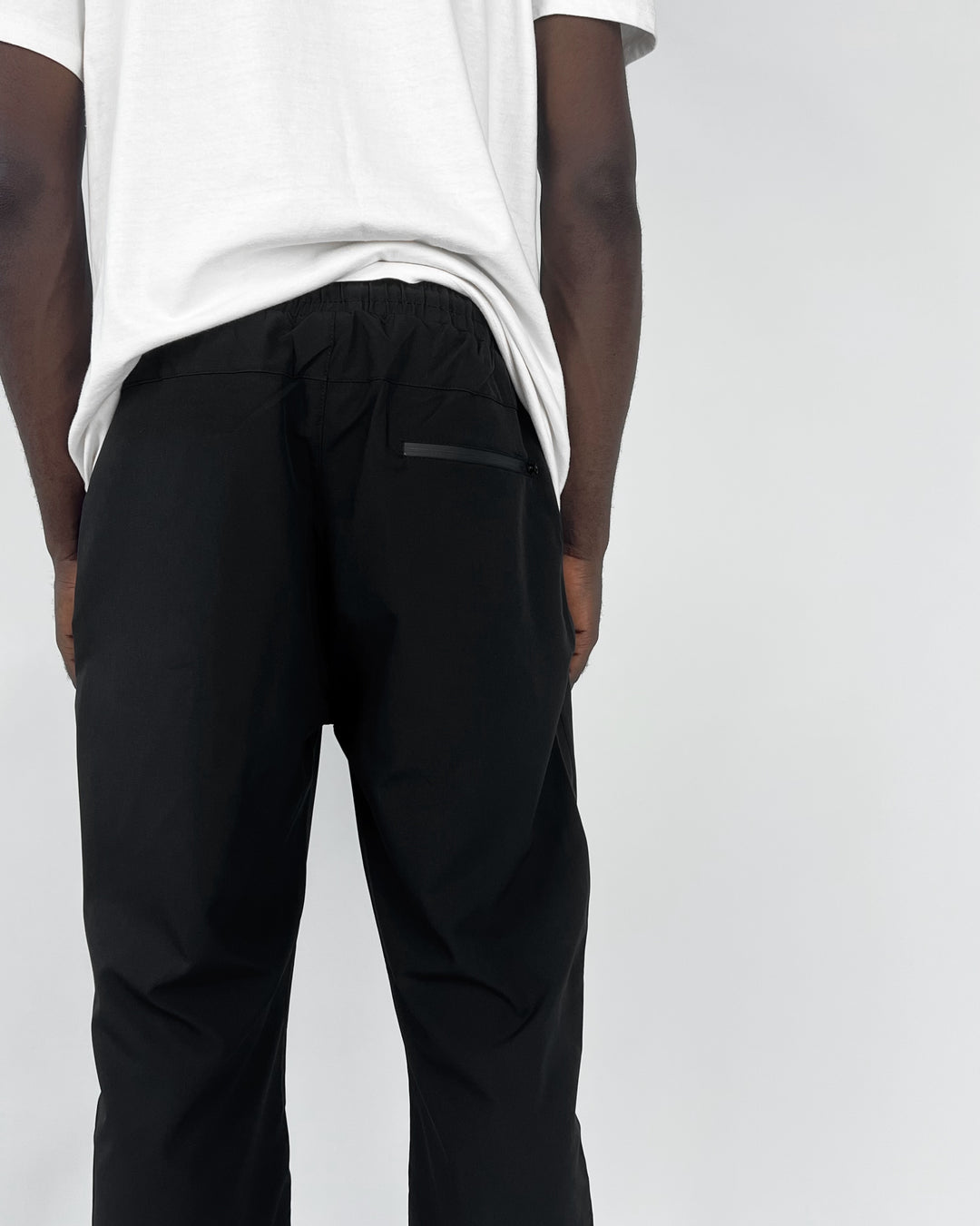 Nike reflective logo track pants in black