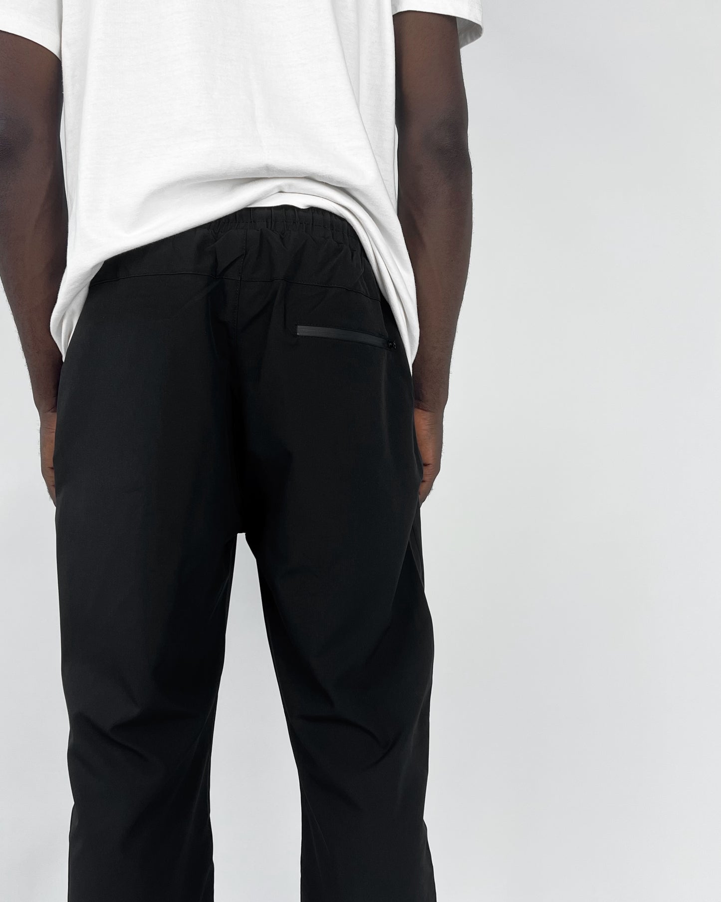 Nike reflective logo track pants in black – Garmisland