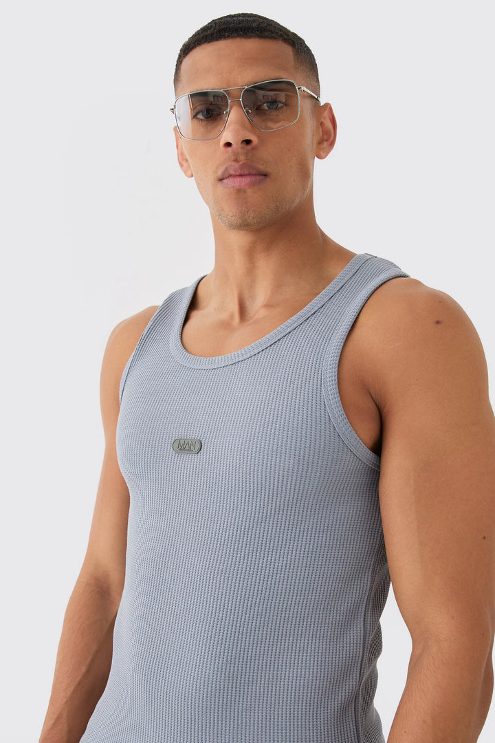 MAN SLIM WAFFLE RUBBER BADGE VEST SLATE BLUE