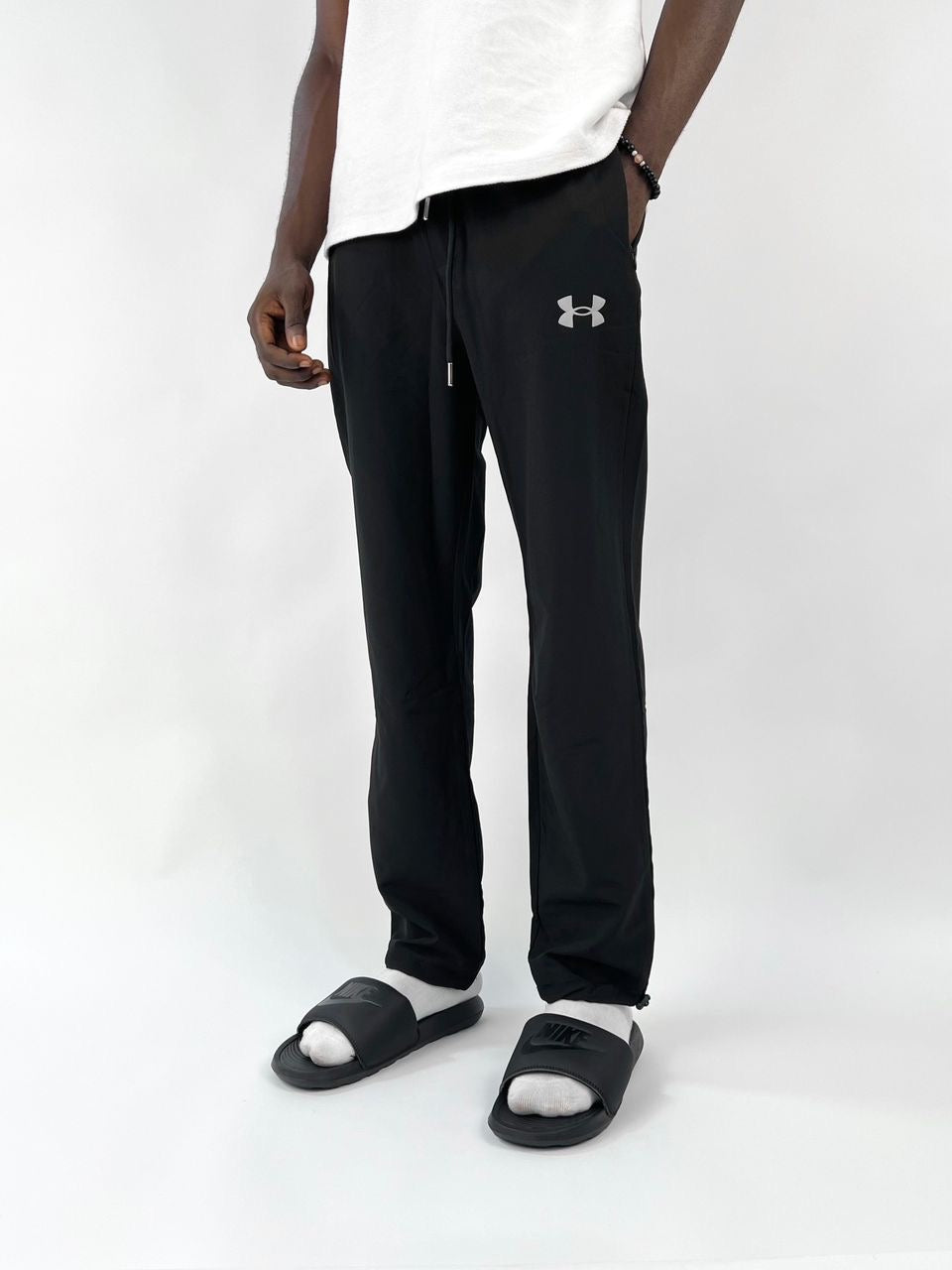 Under armour logo track pants in black