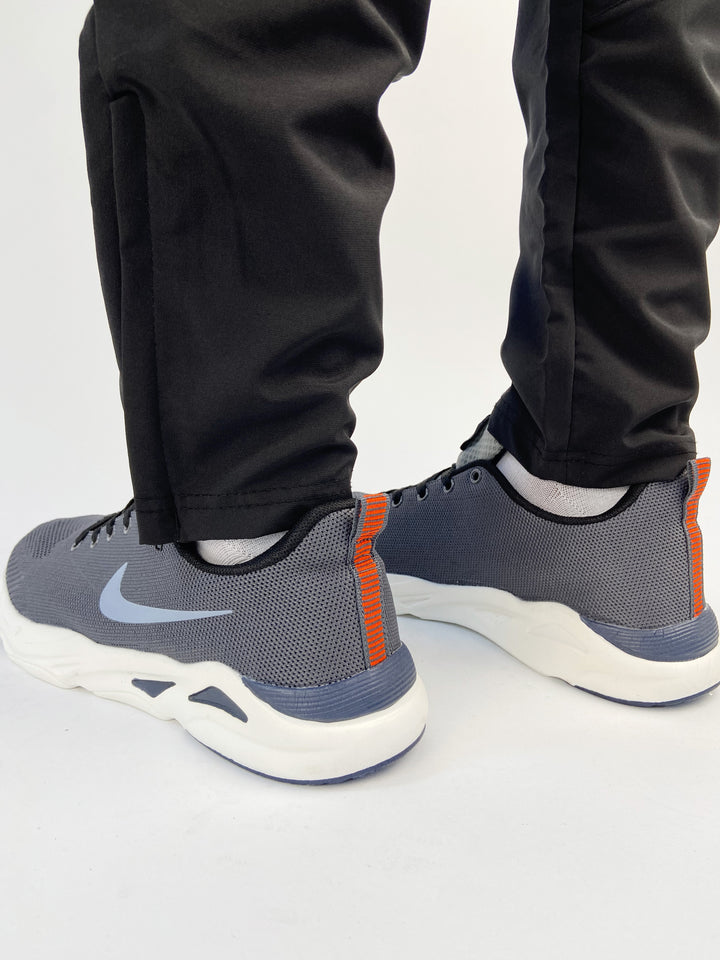 Nike air max trainers with blue logo and orange  back tab