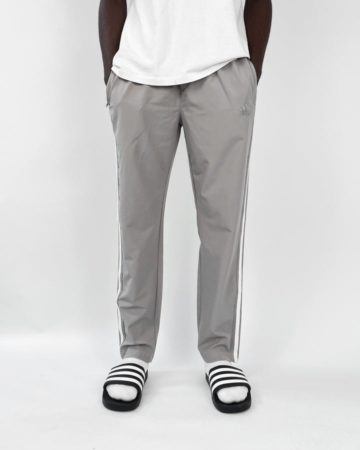 Adidas reflective logo track pants in dark grey