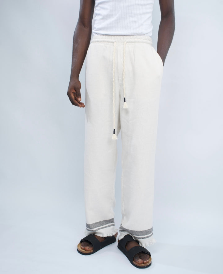 Giesto woven pants with distressed hem in black