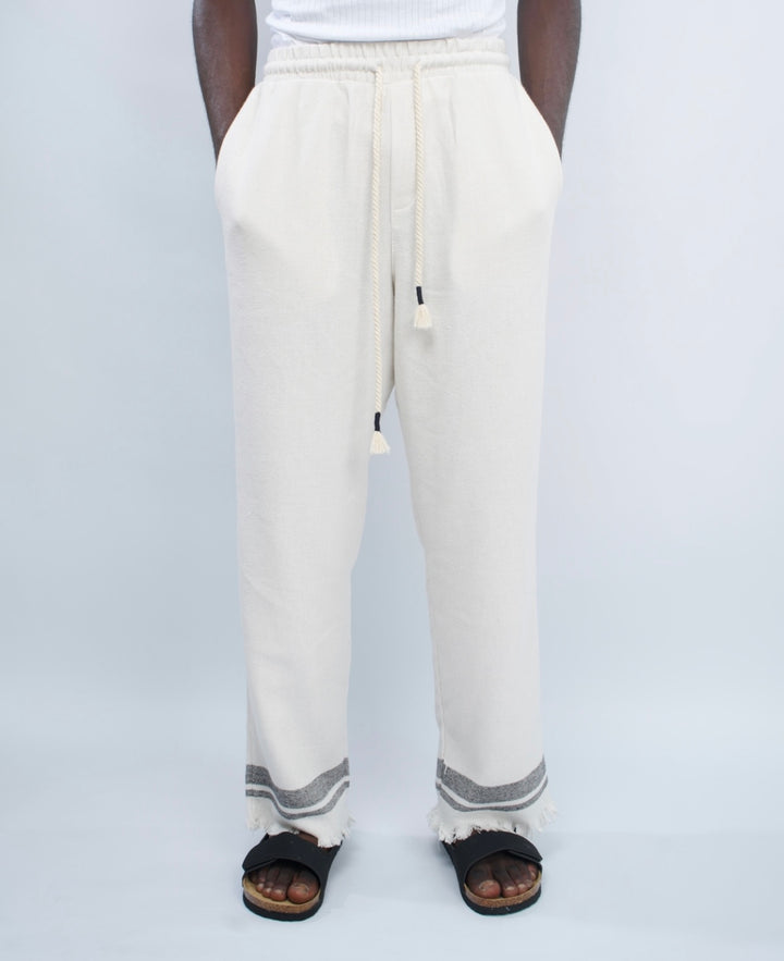 Giesto woven pants with distressed hem in black