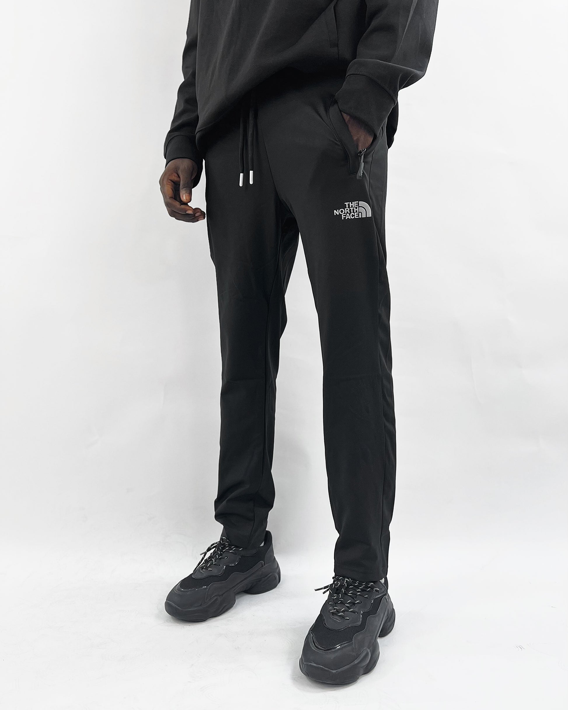 North face reflective logo track pants