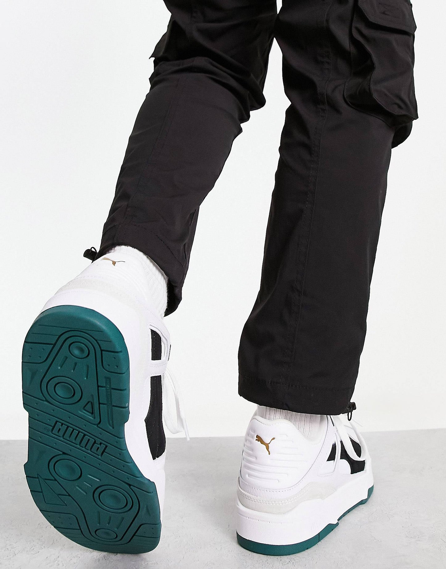 Puma slipstream trainers in white with black and green suede detail