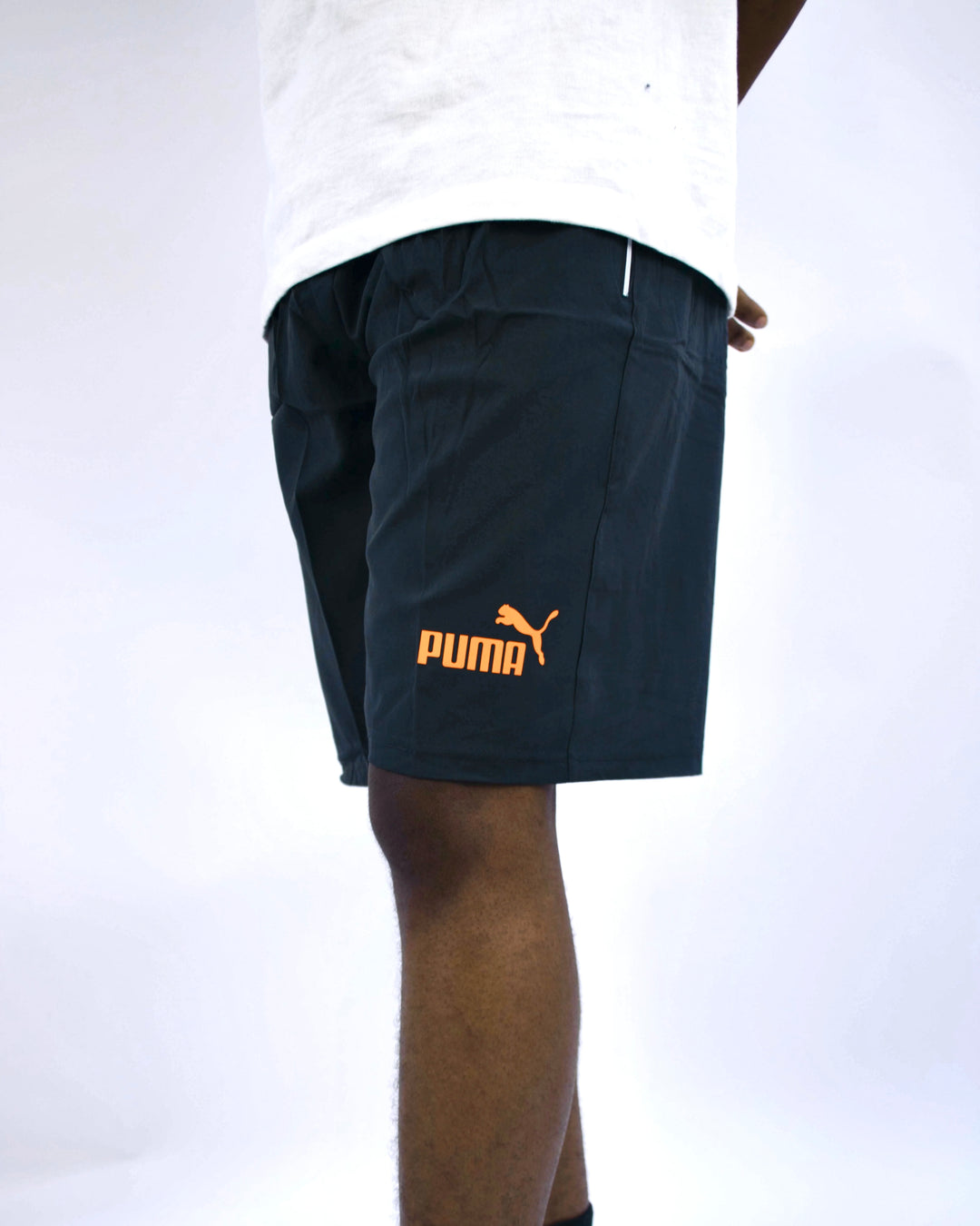 Puma sports shorts with orange logo