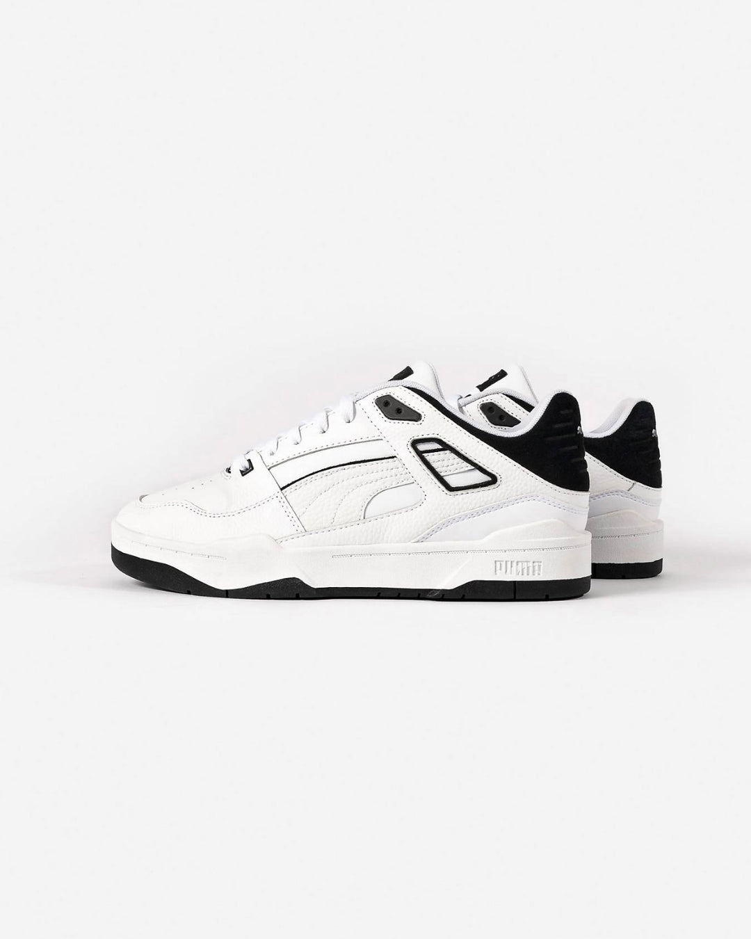 Puma slipstream trainers in white and black