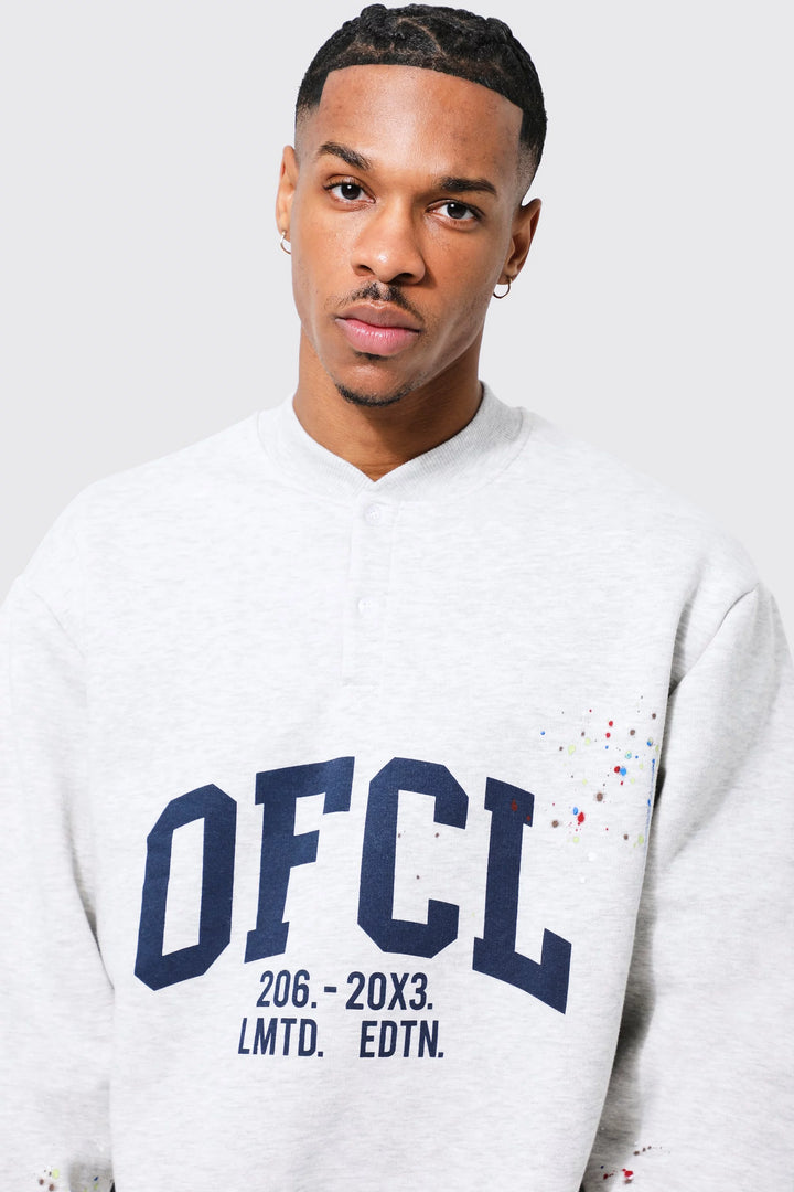 BOOHOOMAN OVERSIZED VARSITY PAINT SPLATTER SWEATSHIRT